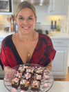Cat Cora’s Eggnog Cheesecake Brownies with Crushed Peppermint Topping